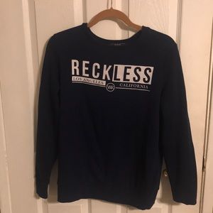Young and Reckless crew neck.